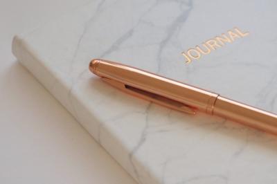 journal with rose gold pen